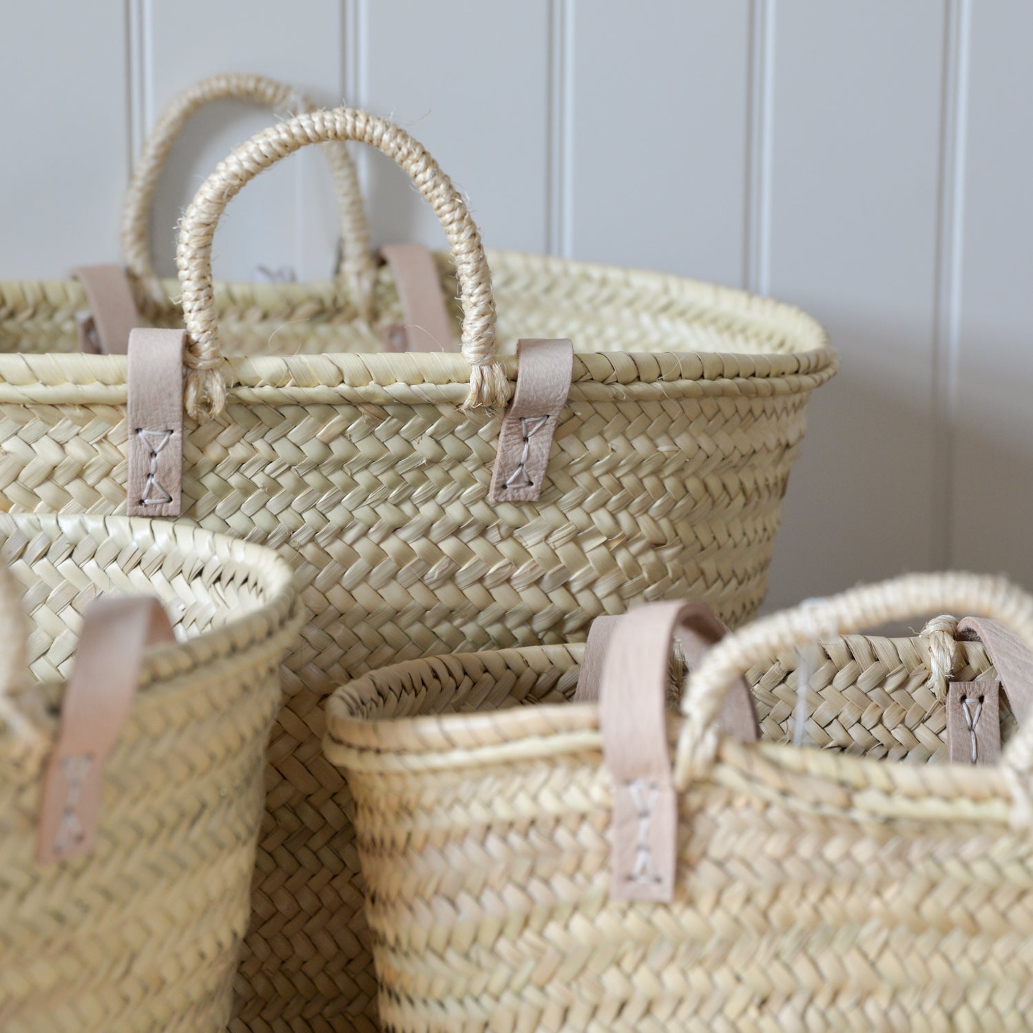 Set of woven baskets with handles
