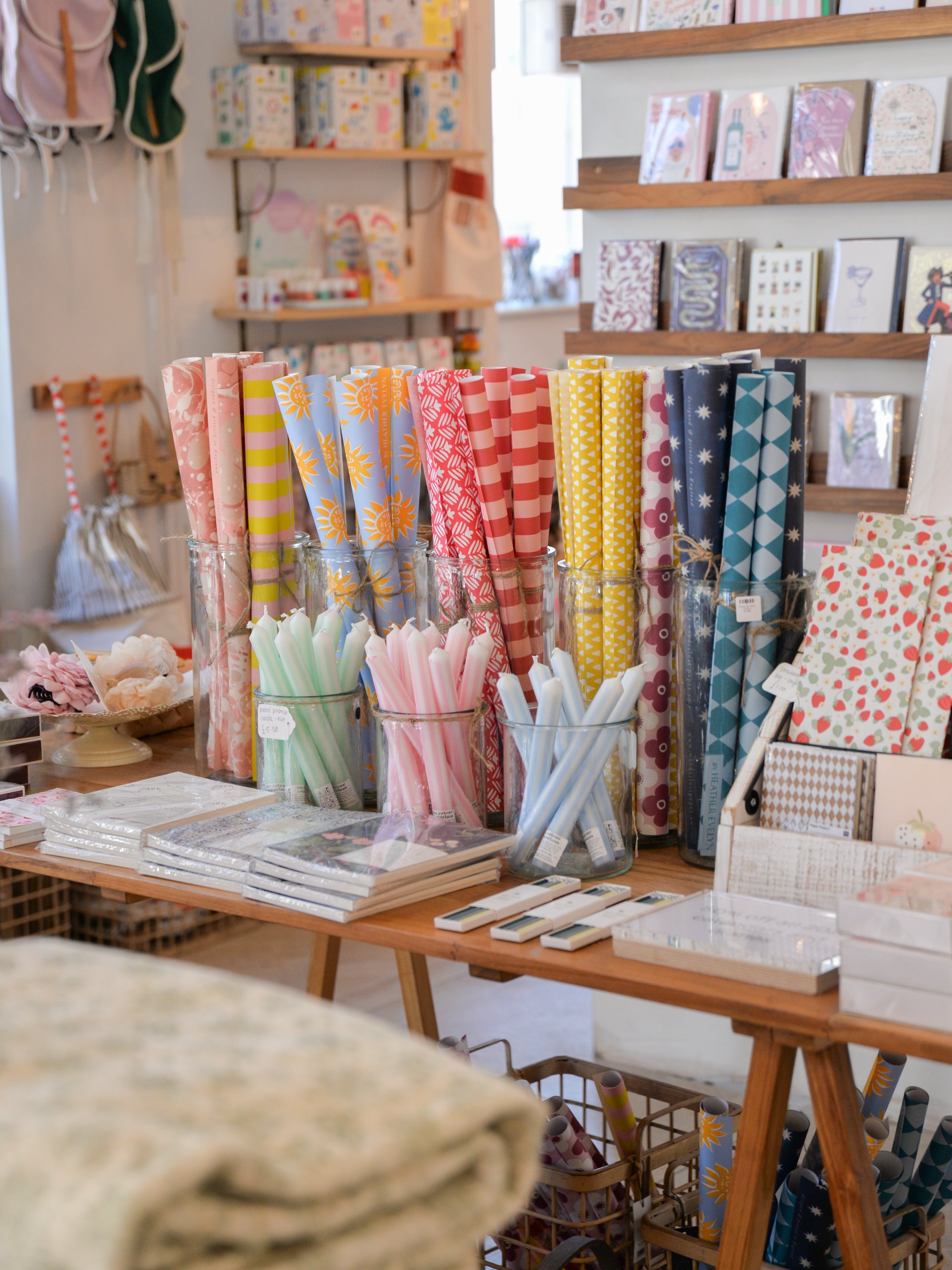 Homeware and gift store with wrapping paper, greetings cards and stationery items on display.