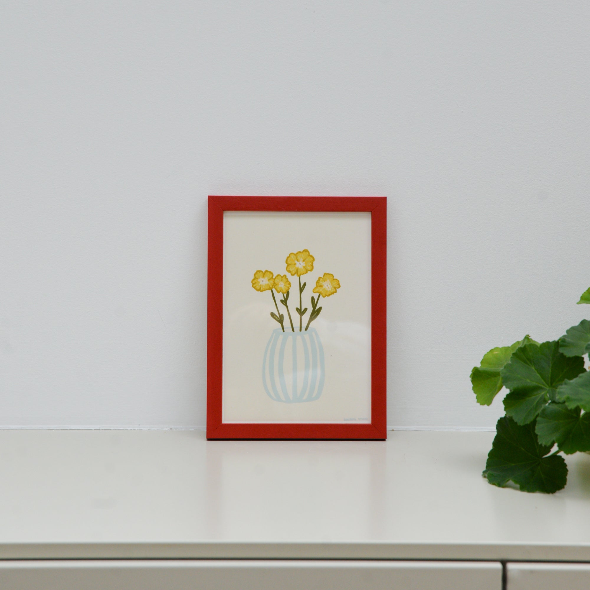 Yellow Flowers in a Blue Vase by Engberg Studio - A5