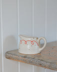 Milk Jug with Red Bow