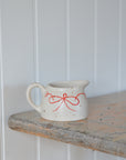 Milk Jug with Red Bow