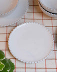 pearl white china bread plate with ribbed detail edging