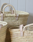 Set of woven baskets with handles
