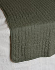 Olive Green Quilt With Cross Stitches