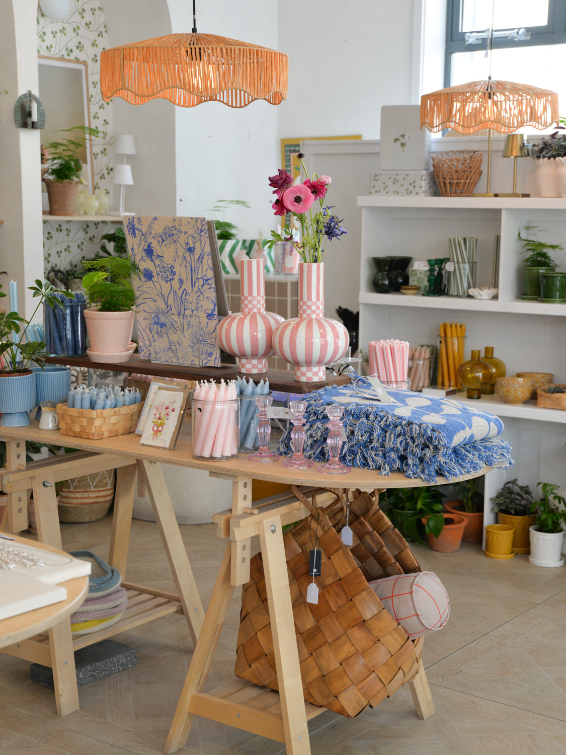 Interior of Mon Pote homeware shop in Bristol. Decorative items on tables and shelves.
