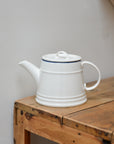 White Porcelain Teapot with Blue Rim