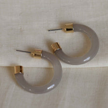 Load image into Gallery viewer, big Metal London Isabelle medium sized glossy eco resin off white grey half hoops with gold metal ends hypoallergenic
