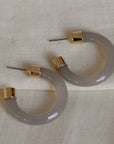 big Metal London Isabelle medium sized glossy eco resin off white grey half hoops with gold metal ends hypoallergenic
