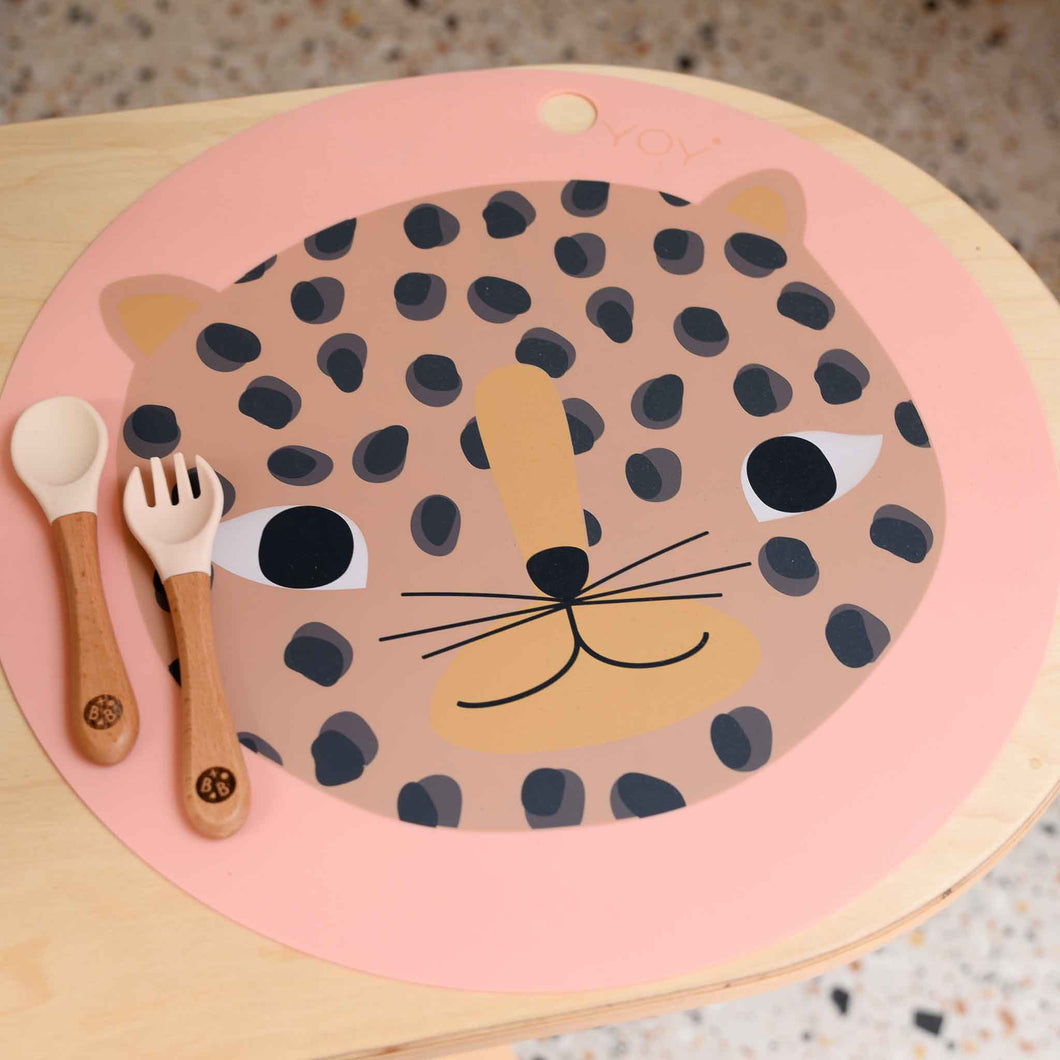 OYOY branded children's dinner time pink placemat snow leopard face design
