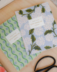 set of two mini notebooks rifle paper co hydrangea flower design  blue and green colour
