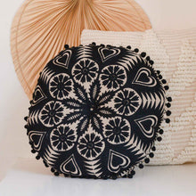Load image into Gallery viewer, Black and neutral off white round filled cotton  cushion embroidered with black pom pom tassels by Bloomingville